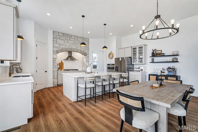213 Bluegrass Pasture Ct, Wentzville, MO 63385 - dining space with a chandelier, recessed lighting, and dark wood-style flooring