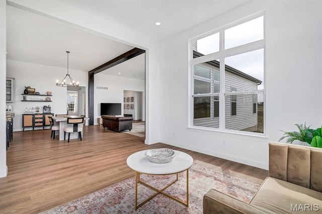 213 Bluegrass Pasture Ct, Wentzville, MO 63385 - living area featuring a chandelier and wood finished floors