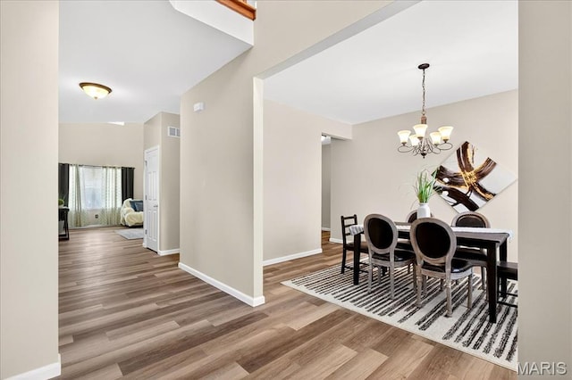 621 Royal Crest Way, Ofallon, IL 62269 - dining space featuring wood finished floors and a chandelier