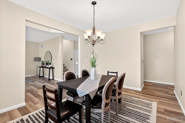 621 Royal Crest Way, Ofallon, IL 62269 - dining room featuring a chandelier, light wood-style floors, and stairway