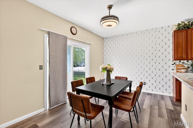 621 Royal Crest Way, Ofallon, IL 62269 - dining space with an accent wall, wallpapered walls, and dark wood-style floors