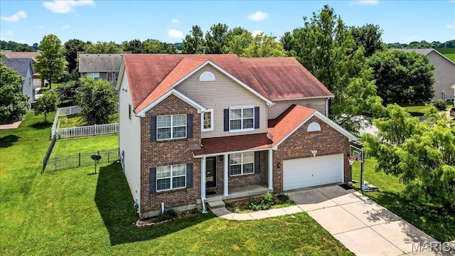 621 Royal Crest Way, Ofallon, IL 62269 - traditional home featuring an attached garage, concrete driveway, brick siding, and covered porch
