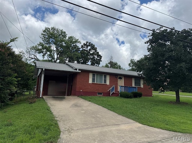 737 Price St, Poplar Bluff, MO 63901 - ranch-style home featuring brick siding, driveway, a front lawn, a metal roof, and a carport