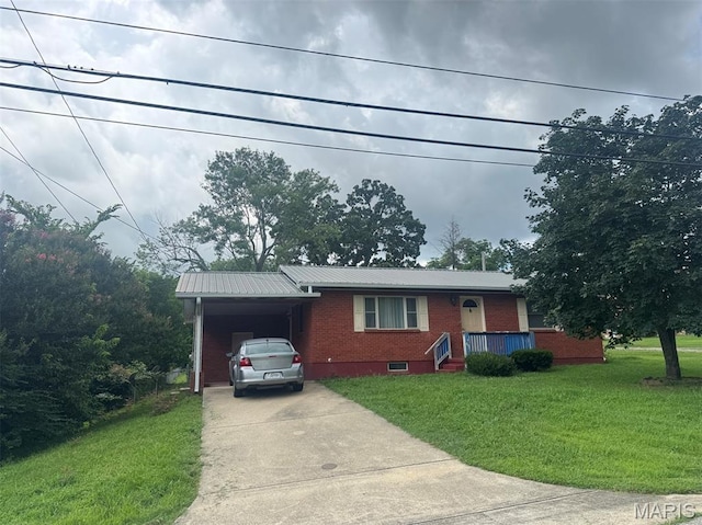 737 Price St, Poplar Bluff, MO 63901 - ranch-style house with brick siding, driveway, a front lawn, a metal roof, and an attached carport