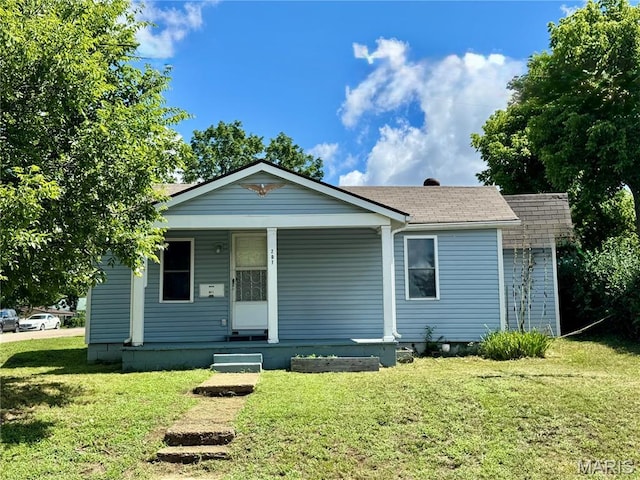 207 Cordia Ave, Potosi, MO 63664 - view of front of house featuring a front yard, a porch, and a shingled roof