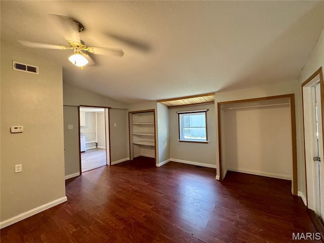 207 Cordia Ave, Potosi, MO 63664 - unfurnished bedroom with lofted ceiling, two closets, dark wood-style flooring, and a ceiling fan