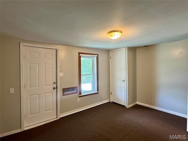 207 Cordia Ave, Potosi, MO 63664 - entrance foyer featuring baseboards and dark colored carpet