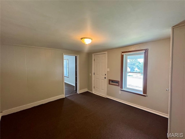 207 Cordia Ave, Potosi, MO 63664 - spare room with baseboards and dark colored carpet