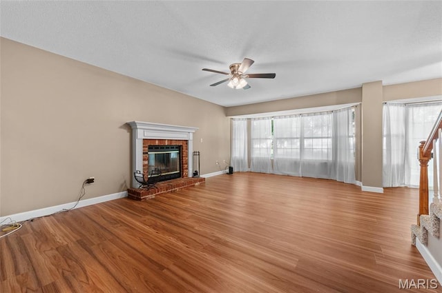 1817 Partridge Pl, Edwardsville, IL 62025 - unfurnished living room featuring light wood-style floors, a ceiling fan, and a fireplace