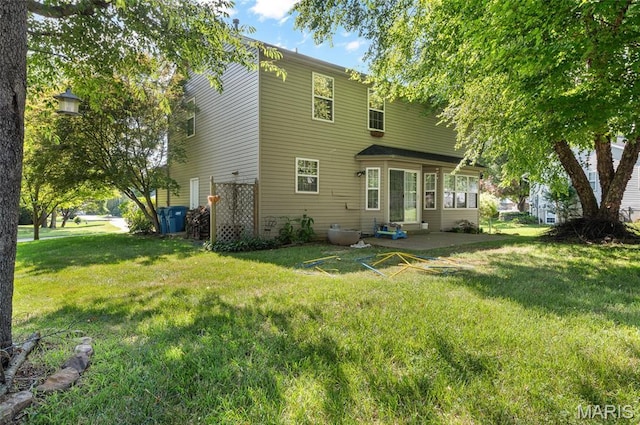 1817 Partridge Pl, Edwardsville, IL 62025 - back of house featuring a lawn and a patio area