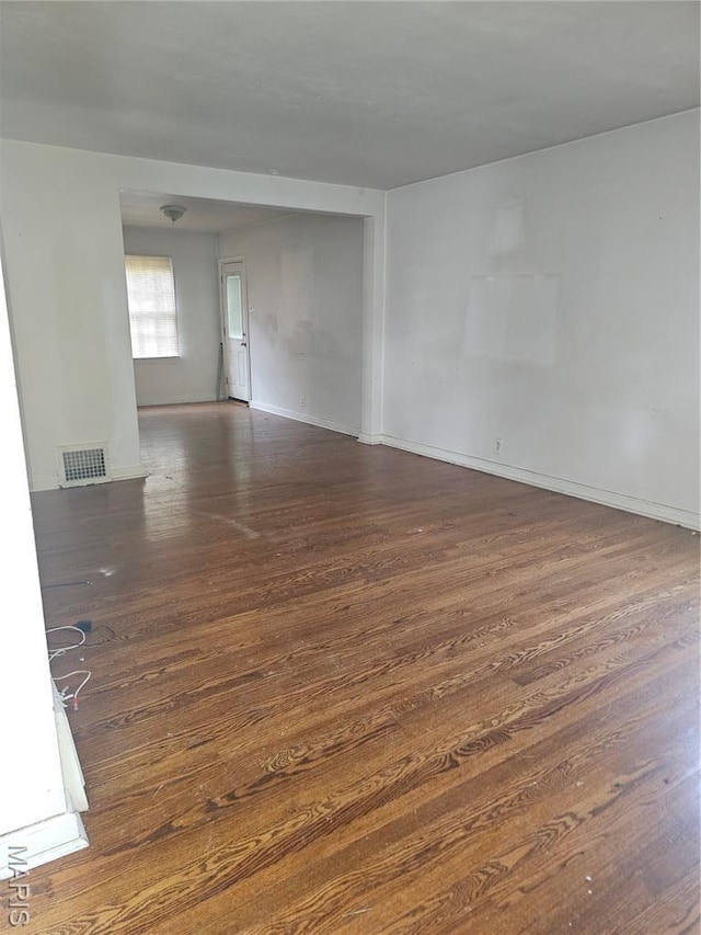 7354 Trenton Ave, Saint Louis, MO 63130 - unfurnished room featuring wood finished floors and baseboards