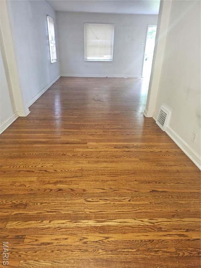 7354 Trenton Ave, Saint Louis, MO 63130 - empty room featuring dark wood finished floors and baseboards