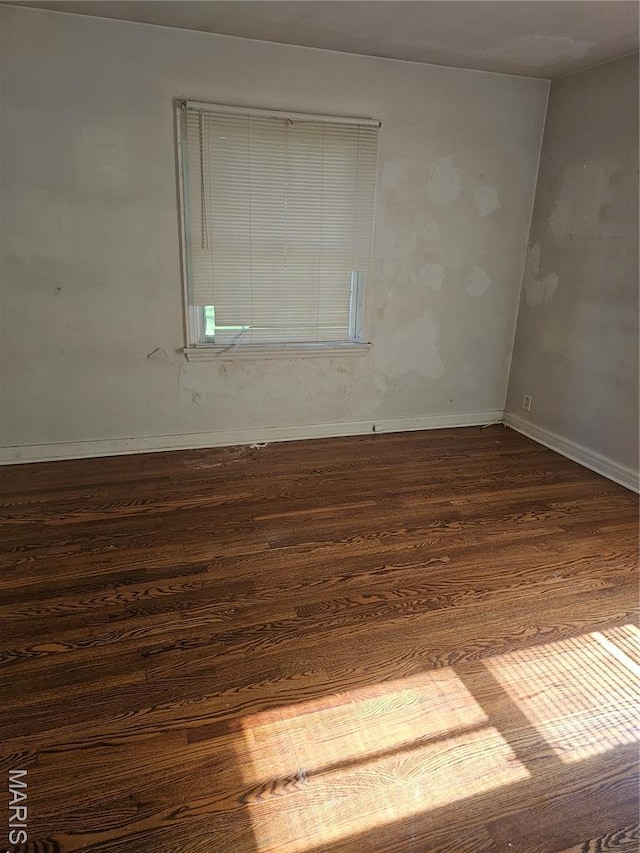 7354 Trenton Ave, Saint Louis, MO 63130 - unfurnished room with dark wood-style flooring and baseboards