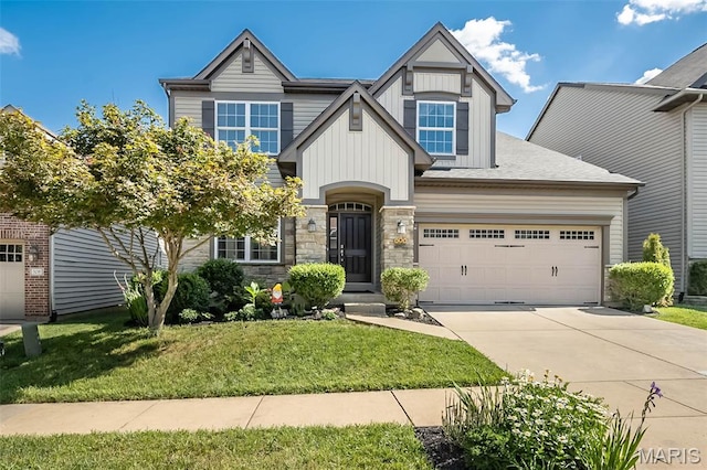 510 Newkirk Cir, Saint Charles, MO 63303 - craftsman-style house with driveway, board and batten siding, a front yard, a garage, and stone siding