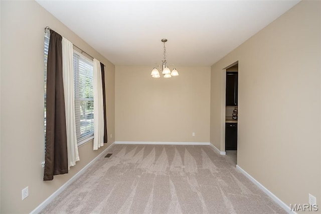 510 Newkirk Cir, Saint Charles, MO 63303 - unfurnished room featuring a chandelier and light carpet