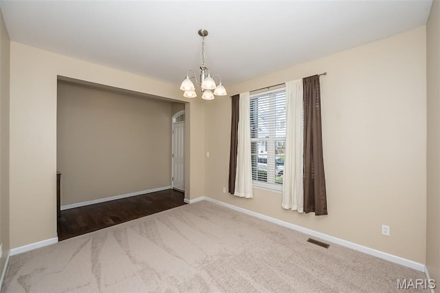 510 Newkirk Cir, Saint Charles, MO 63303 - carpeted empty room featuring a chandelier and baseboards