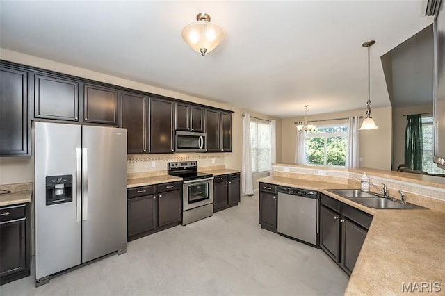 510 Newkirk Cir, Saint Charles, MO 63303 - kitchen with stainless steel appliances, light countertops, and backsplash