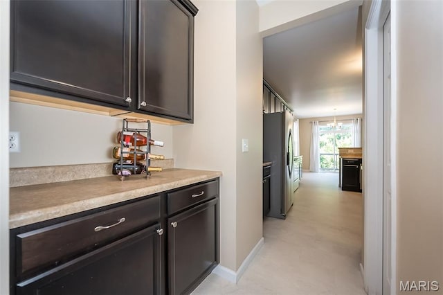 510 Newkirk Cir, Saint Charles, MO 63303 - kitchen featuring light countertops, stainless steel fridge with ice dispenser, and a chandelier
