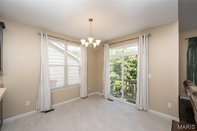 510 Newkirk Cir, Saint Charles, MO 63303 - unfurnished dining area with a chandelier and light colored carpet