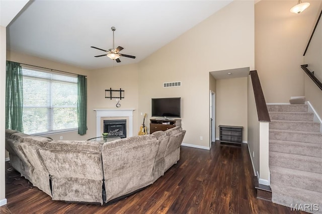 510 Newkirk Cir, Saint Charles, MO 63303 - living area featuring a ceiling fan, dark wood-style flooring, a glass covered fireplace, stairway, and high vaulted ceiling