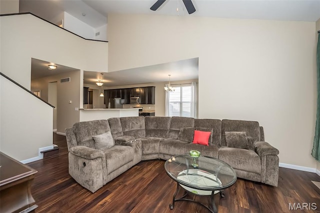510 Newkirk Cir, Saint Charles, MO 63303 - living area featuring dark wood finished floors, a ceiling fan, lofted ceiling, and a chandelier