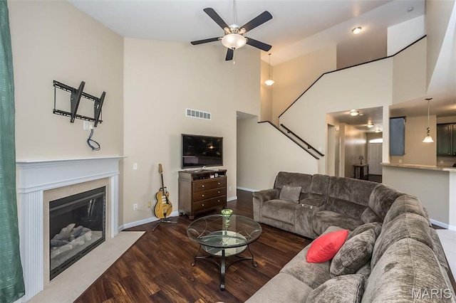 510 Newkirk Cir, Saint Charles, MO 63303 - living area with wood finished floors, high vaulted ceiling, a ceiling fan, and a fireplace with flush hearth