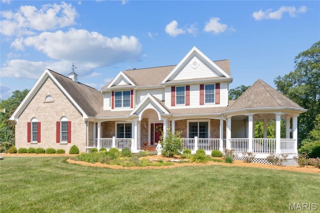 1605 High Sierra Dr, Foristell, MO 63348 - view of front of house featuring covered porch, a front yard, and brick siding