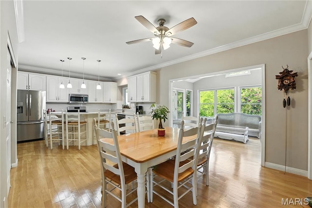 1605 High Sierra Dr, Foristell, MO 63348 - dining area featuring light wood finished floors, crown molding, and a ceiling fan