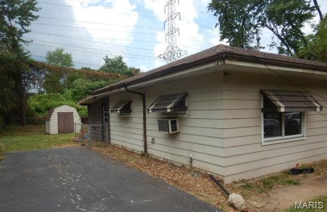 11947 Bridgevale Ave, Saint Louis, MO 63138 - view of side of home featuring a storage shed