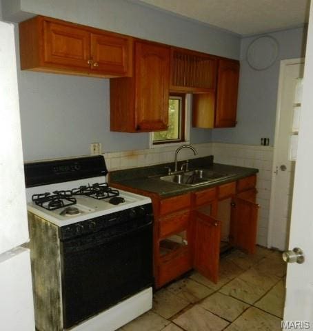 11947 Bridgevale Ave, Saint Louis, MO 63138 - kitchen with white appliances, dark countertops, and light tile patterned floors