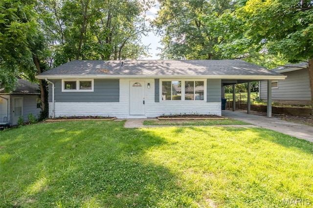 10141 Ventura Dr, Ferguson Township, MO 63136 - single story home featuring driveway, an attached carport, a front yard, brick siding, and a shingled roof