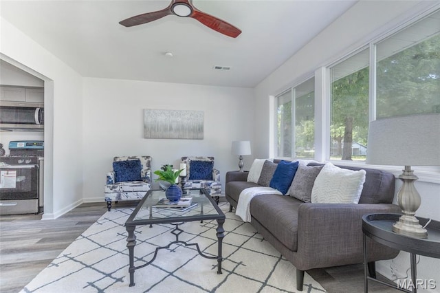 10141 Ventura Dr, Ferguson Township, MO 63136 - living area with wood finished floors and ceiling fan