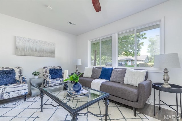 10141 Ventura Dr, Ferguson Township, MO 63136 - living room with wood finished floors and ceiling fan