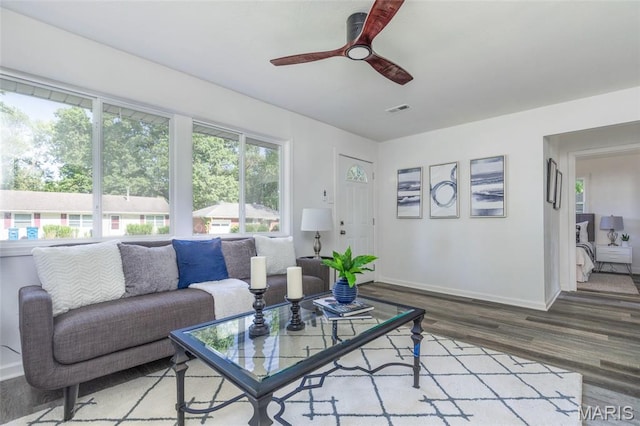 10141 Ventura Dr, Ferguson Township, MO 63136 - living area with ceiling fan and wood finished floors