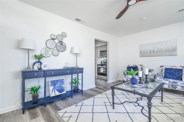10141 Ventura Dr, Ferguson Township, MO 63136 - living room with wood finished floors and a ceiling fan