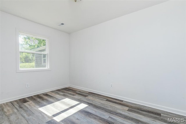 10141 Ventura Dr, Ferguson Township, MO 63136 - spare room featuring wood finished floors and baseboards
