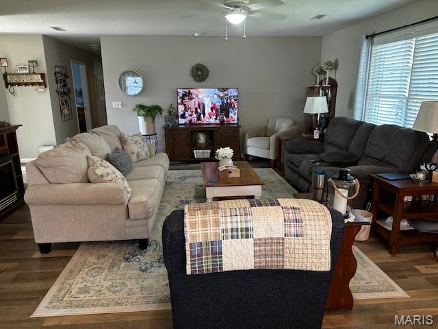 1010 Pine St, Sikeston, MO 63801 - living room with wood finished floors and ceiling fan