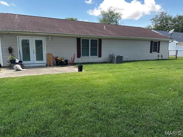 1010 Pine St, Sikeston, MO 63801 - rear view of house featuring french doors and a patio area