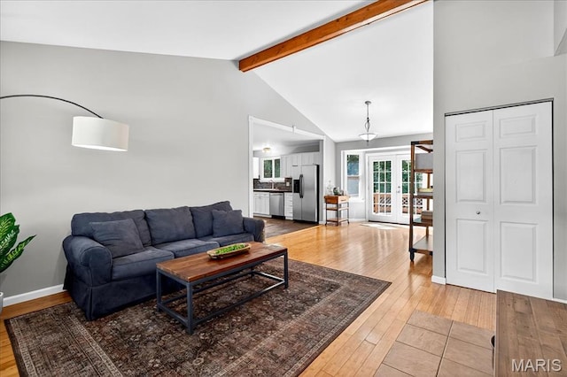 1826 Fairwood Forest Dr, Saint Peters, MO 63376 - living area with wood-type flooring, beamed ceiling, french doors, and high vaulted ceiling