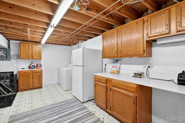 1826 Fairwood Forest Dr, Saint Peters, MO 63376 - kitchen featuring freestanding refrigerator, independent washer and dryer, light countertops, and light flooring