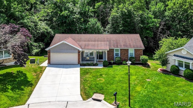 1826 Fairwood Forest Dr, Saint Peters, MO 63376 - ranch-style home with driveway, an attached garage, brick siding, and a front yard