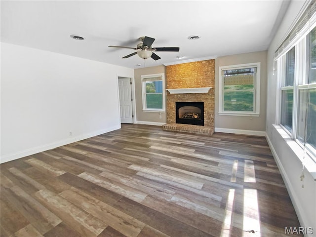 248 Ramsey Ln, Ballwin, MO 63021 - unfurnished living room featuring healthy amount of natural light, wood finished floors, and ceiling fan