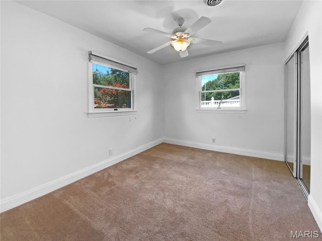 248 Ramsey Ln, Ballwin, MO 63021 - unfurnished bedroom featuring a closet, carpet floors, and ceiling fan