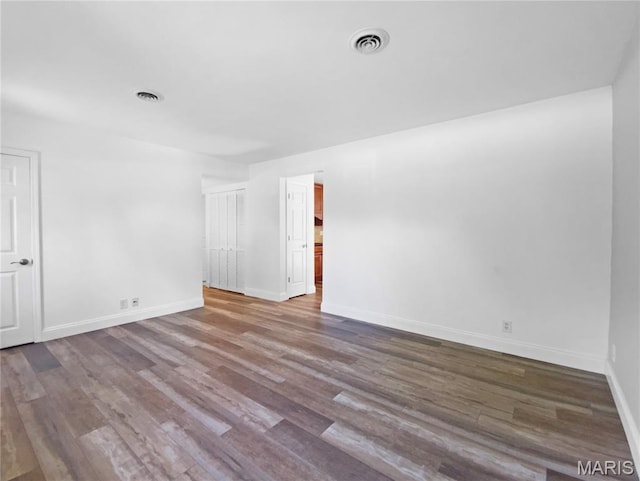 248 Ramsey Ln, Ballwin, MO 63021 - spare room featuring wood finished floors and baseboards