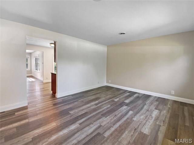 248 Ramsey Ln, Ballwin, MO 63021 - empty room featuring dark wood-style flooring and baseboards