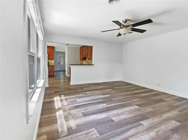 248 Ramsey Ln, Ballwin, MO 63021 - unfurnished living room featuring ceiling fan and wood finished floors