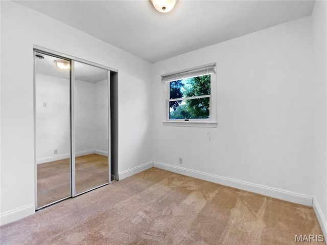 248 Ramsey Ln, Ballwin, MO 63021 - unfurnished bedroom featuring carpet floors and a closet