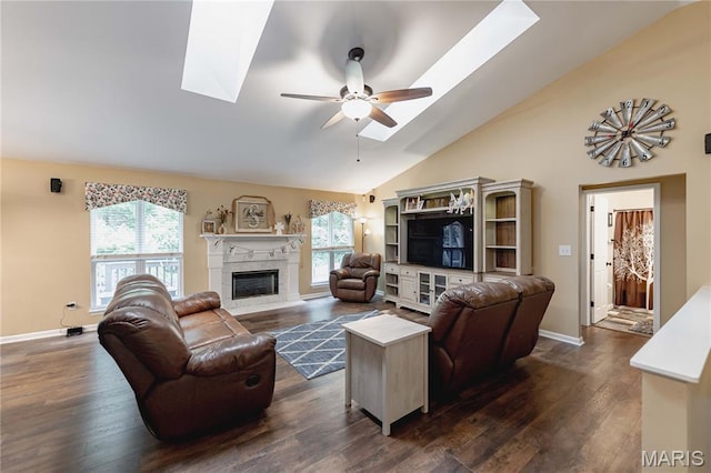 1923 Smizer Mill Rd, Fenton, MO 63026 - living room featuring ceiling fan, a skylight, a fireplace with flush hearth, dark wood-style flooring, and high vaulted ceiling