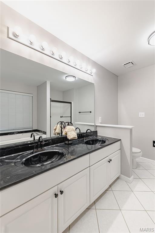 1923 Smizer Mill Rd, Fenton, MO 63026 - full bath with double vanity and tile patterned floors