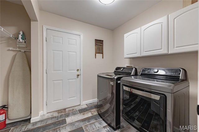 1923 Smizer Mill Rd, Fenton, MO 63026 - washroom featuring washing machine and clothes dryer, cabinet space, and wood finished floors